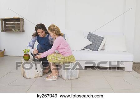 Woman and her daughter with mortar and pestle View Large Photo Image Stock Photo - Woman and her daughter with mortar and pestle. Fotosearch