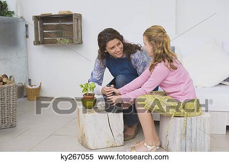 Woman and her daughter with mortar and pestle View Large Photo Image Stock Photography - Woman and her daughter with mortar and pestle. Fotosearch