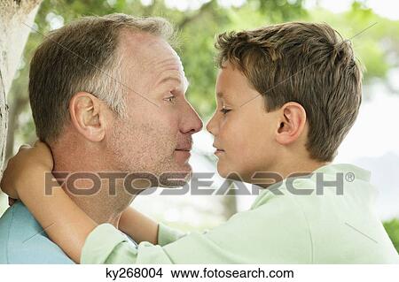 Man and his son rubbing noses View Large Photo Image Picture - Man and his son rubbing noses. Fotosearch
