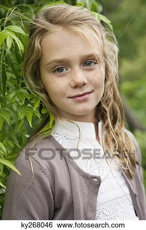 Portrait of a girl smiling View Large Photo Image Stock Photograph - Portrait of a girl smiling. Fotosearch