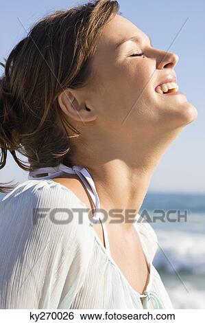 Close-up of a woman smiling View Large Photo Image Stock Photograph - Close-up of a woman smiling. Fotosearch