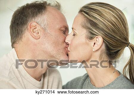 Close-up of a couple kissing View Large Photo Image Picture - Close-up of a couple kissing. Fotosearch