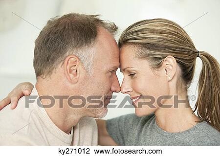 Close-up of a couple romancing View Large Photo Image Stock Image - Close-up of a couple romancing. Fotosearch