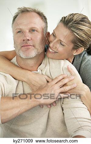 Close-up of a couple romancing View Large Photo Image Stock Photo - Close-up of a couple romancing. Fotosearch