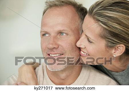 Stock Photo - Close-up of a couple romancing. Fotosearch