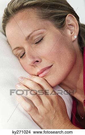 Picture - Close-up of a woman napping. Fotosearch