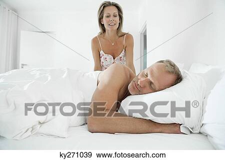 Couple in a bedroom View Large Photo Image Stock Photo - Couple in a bedroom. Fotosearch