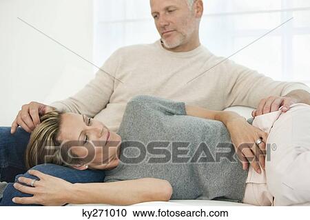 Couple on the bed View Large Photo Image Stock Image - Couple on the bed. Fotosearch