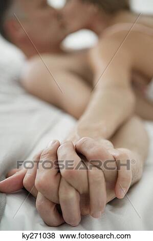 Couple romancing on the bed View Large Photo Image Stock Photo - Couple romancing on the bed. Fotosearch