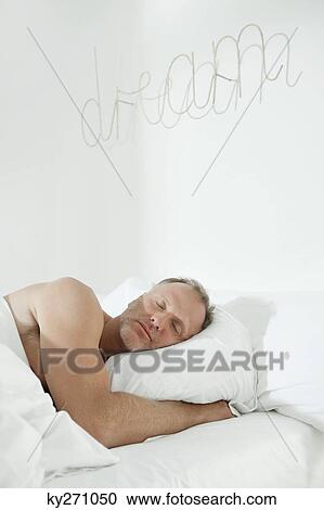 Man sleeping on the bed View Large Photo Image Stock Image - Man sleeping on the bed. Fotosearch