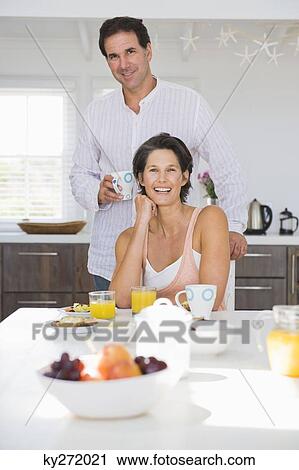 Stock Image - Couple having breakfast. Fotosearch