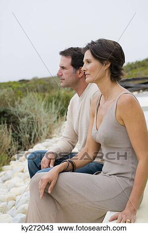 Couple looking at a view View Large Photo Image Stock Image - Couple looking at a view. Fotosearch