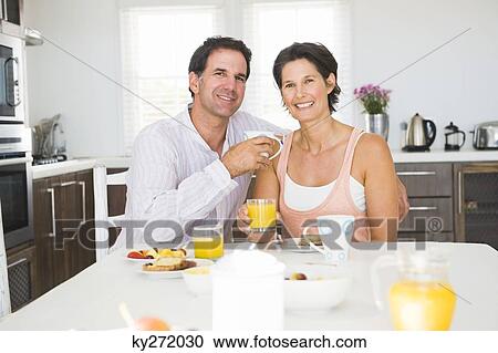 Portrait of a couple having breakfast View Large Photo Image Stock Image - Portrait of a couple having breakfast. Fotosearch