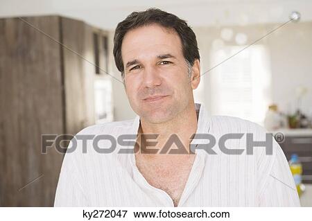 Portrait of a man smiling View Large Photo Image Stock Photo - Portrait of a man smiling. Fotosearch