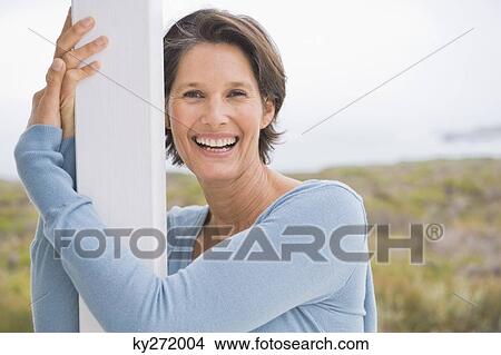 Portrait of a woman smiling View Large Photo Image Picture - Portrait of a woman smiling. Fotosearch
