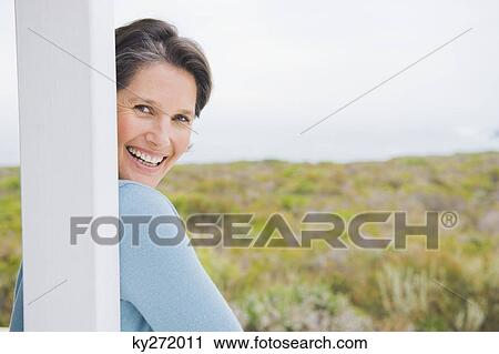 Stock Image - Portrait of a woman smiling. Fotosearch