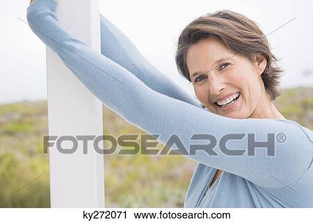 Portrait of a woman smiling View Large Photo Image Stock Image - Portrait of a woman smiling. Fotosearch