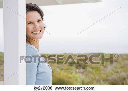 Portrait of a woman smiling View Large Photo Image Stock Photo - Portrait of a woman smiling. Fotosearch