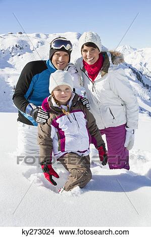 Happy family in snow View Large Photo Image Picture - Happy family in snow. Fotosearch