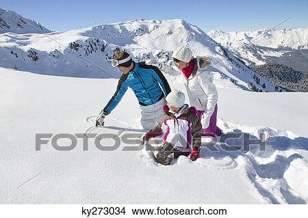 Happy family in snow View Large Photo Image Picture - Happy family in snow. Fotosearch