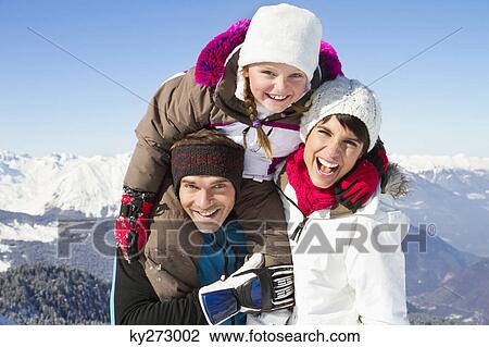 Happy family in snow View Large Photo Image Stock Image - Happy family in snow. Fotosearch