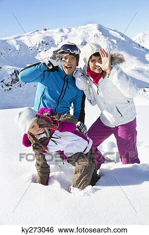 Happy family in snow View Large Photo Image Stock Photograph - Happy family in snow. Fotosearch