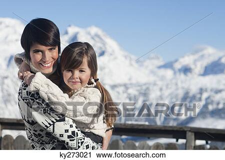 Mother and daughter hugging View Large Photo Image Stock Image - Mother and daughter hugging. Fotosearch