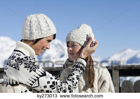 Mother applying lip balm to her daughter View Large Photo Image Stock Image - Mother applying lip balm to her daughter. Fotosearch