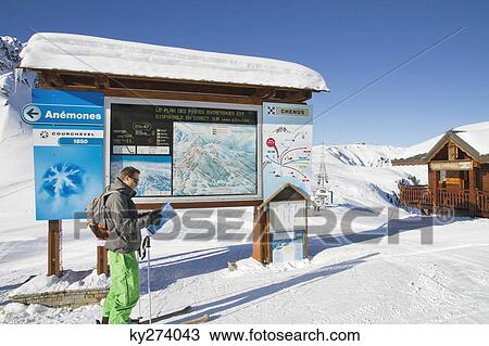 Male skier looking at map, Courchevel, France View Large Photo Image Stock Image - Male skier looking at map, Courchevel, France. Fotosearch