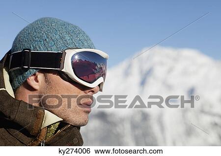 Portrait of man with ski goggles, profile View Large Photo Image Stock Photograph - Portrait of man with ski goggles, profile. Fotosearch