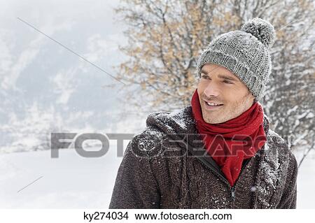 Picture - Portrait of young man in winter clothes. Fotosearch