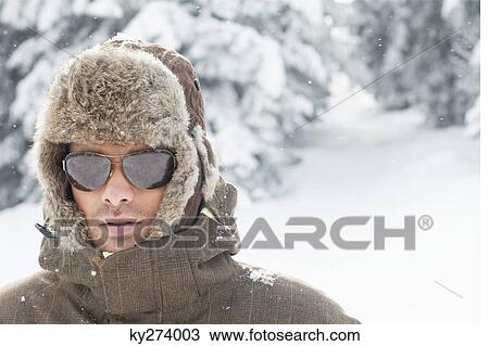 Portrait of young man in winter clothes View Large Photo Image Stock Image - Portrait of young man in winter clothes. Fotosearch