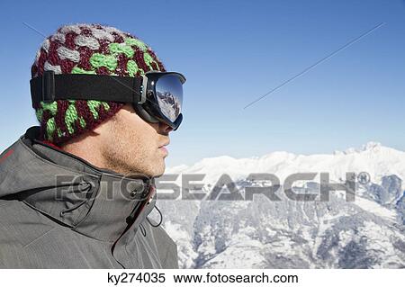 Portrait of young man with ski goggles, profile View Large Photo Image Stock Photography - Portrait of young man with ski goggles, profile. Fotosearch