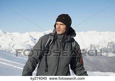 Young man in ski wear looking away View Large Photo Image Stock Photography - Young man in ski wear looking away. Fotosearch
