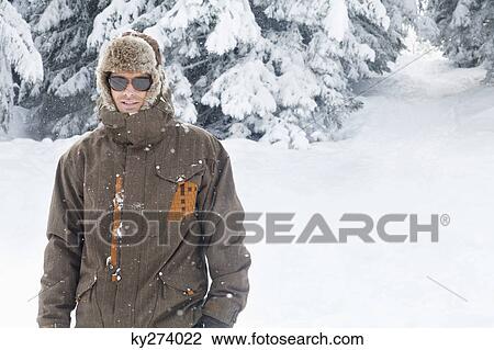 Young man in winter clothes View Large Photo Image Stock Image - Young man in winter clothes. Fotosearch