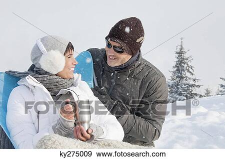 Young couple in ski wear resting View Large Photo Image Stock Photo - Young couple in ski wear resting. Fotosearch