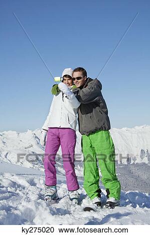 Young couple in ski wear taking self portrait View Large Photo Image Stock Image - Young couple in ski wear taking self portrait. Fotosearch