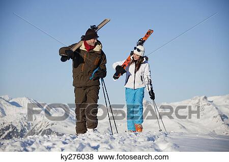 Father and daughter carrying skis View Large Photo Image Stock Photo - Father and daughter carrying skis. Fotosearch