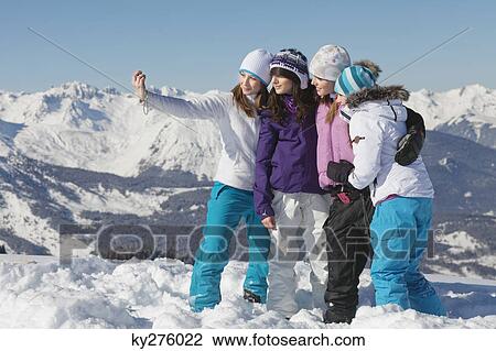 Four teenage girls in ski clothes, taking self portrait View Large Photo Image Stock Image - Four teenage girls in ski clothes, taking self portrait. Fotosearch