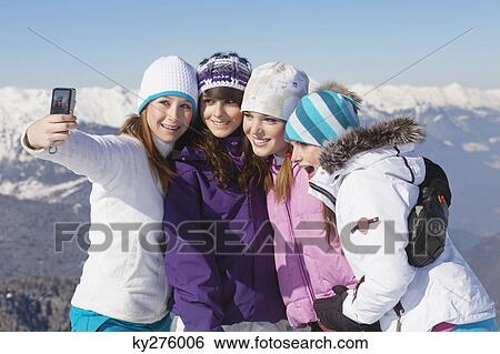 Four teenage girls in ski clothes, taking self portrait View Large Photo Image Stock Photograph - Four teenage girls in ski clothes, taking self portrait. Fotosearch