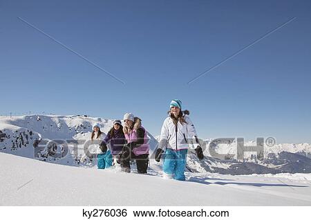 Four teenage girls in ski clothes, walking in snow View Large Photo Image Stock Photograph - Four teenage girls in ski clothes, walking in snow. Fotosearch
