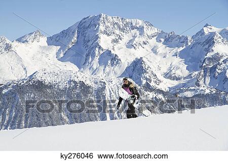 Teenage girl carrying snowboard View Large Photo Image Stock Photograph - Teenage girl carrying snowboard. Fotosearch