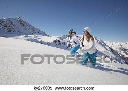 Two teenage girls in ski clothes running in snow View Large Photo Image Stock Photography - Two teenage girls in ski clothes running in snow. Fotosearch