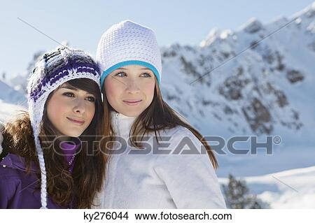 Two teenage girls in winter clothes, embracing View Large Photo Image Picture - Two teenage girls in winter clothes, embracing. Fotosearch