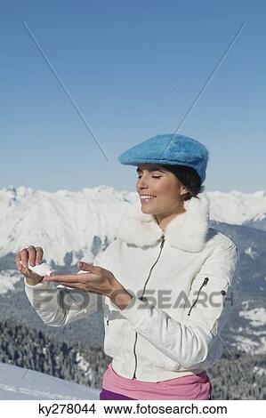 Young woman applying moisturizer View Large Photo Image Picture - Young woman applying moisturizer. Fotosearch