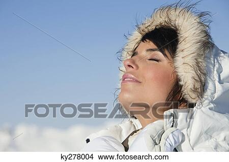 Young woman enjoying winter sun View Large Photo Image Picture - Young woman enjoying winter sun. Fotosearch