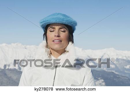 Young woman enjoying winter sun View Large Photo Image Stock Photo - Young woman enjoying winter sun. Fotosearch