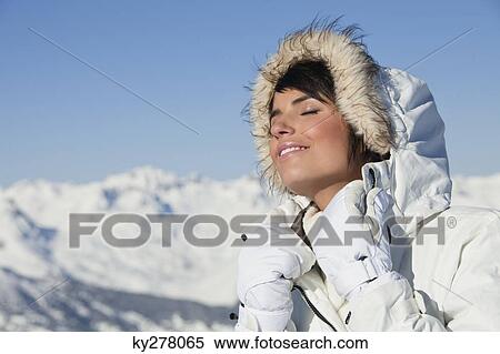 Young woman enjoying winter sun View Large Photo Image Stock Photography - Young woman enjoying winter sun. Fotosearch