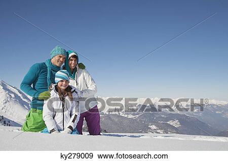 Couple and daughter in ski wear, looking away View Large Photo Image Stock Photo - Couple and daughter in ski wear, looking away. Fotosearch