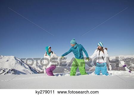 Couple and daughter walking in snow View Large Photo Image Stock Image - Couple and daughter walking in snow. Fotosearch